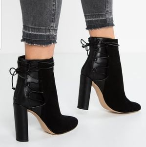High heel almond toe bootie with back detail